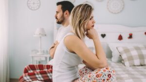 Relationship Problems - dissatisfied couple looking in opposite directions